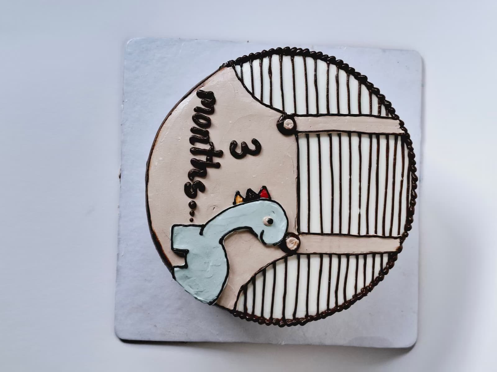 Three-month milestone cake with a stork