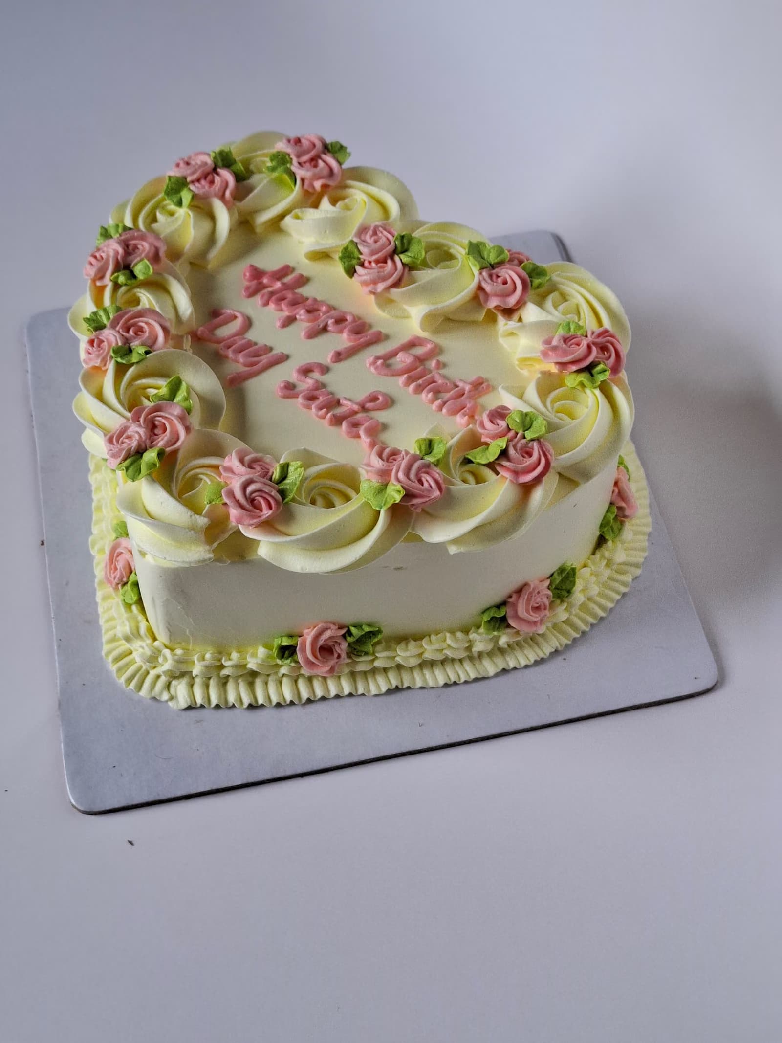 Piped rose heart cake