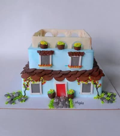 Sculpted two-storey house cake, side view
