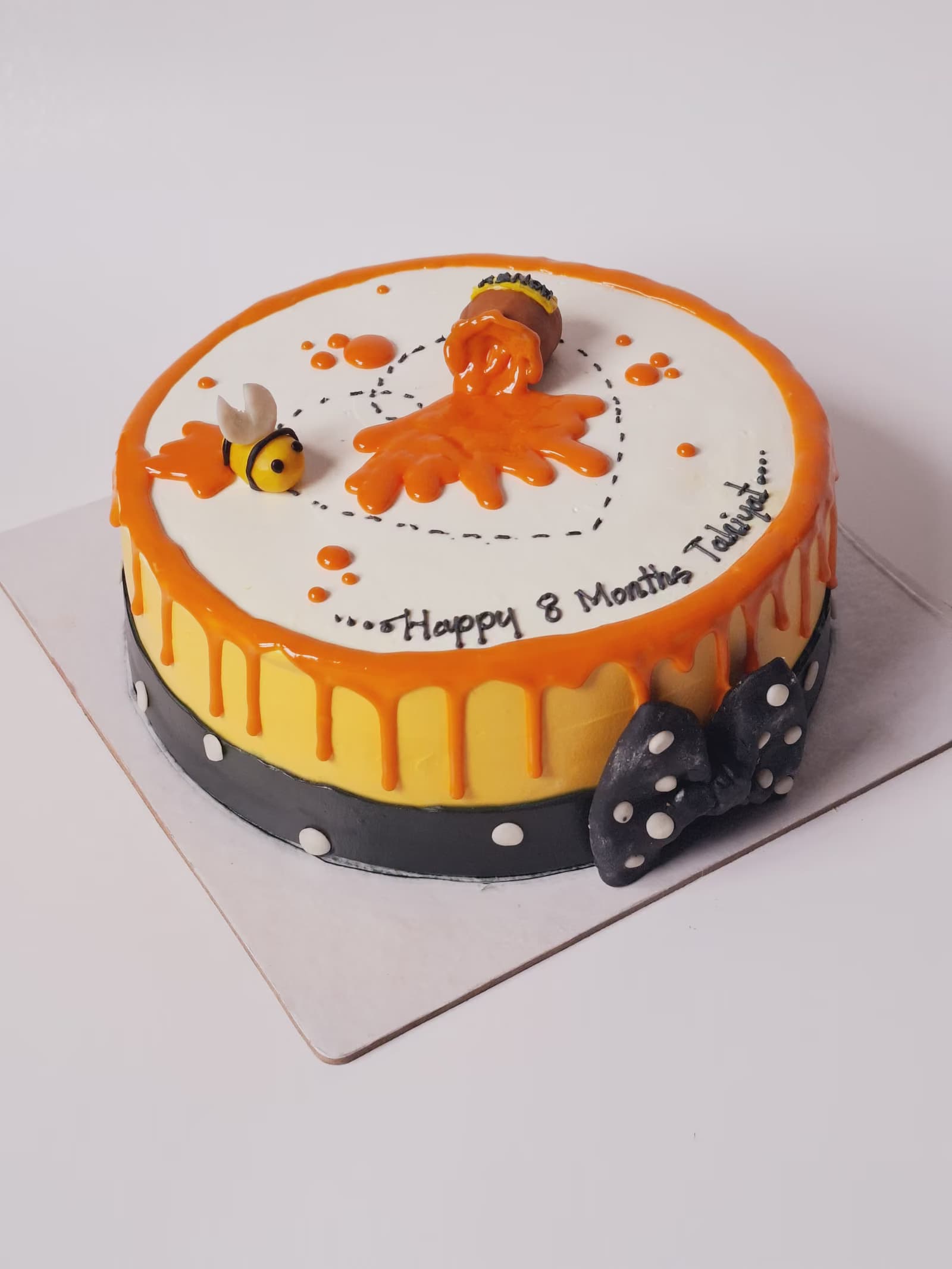Eight-month milestone cake with honey bees