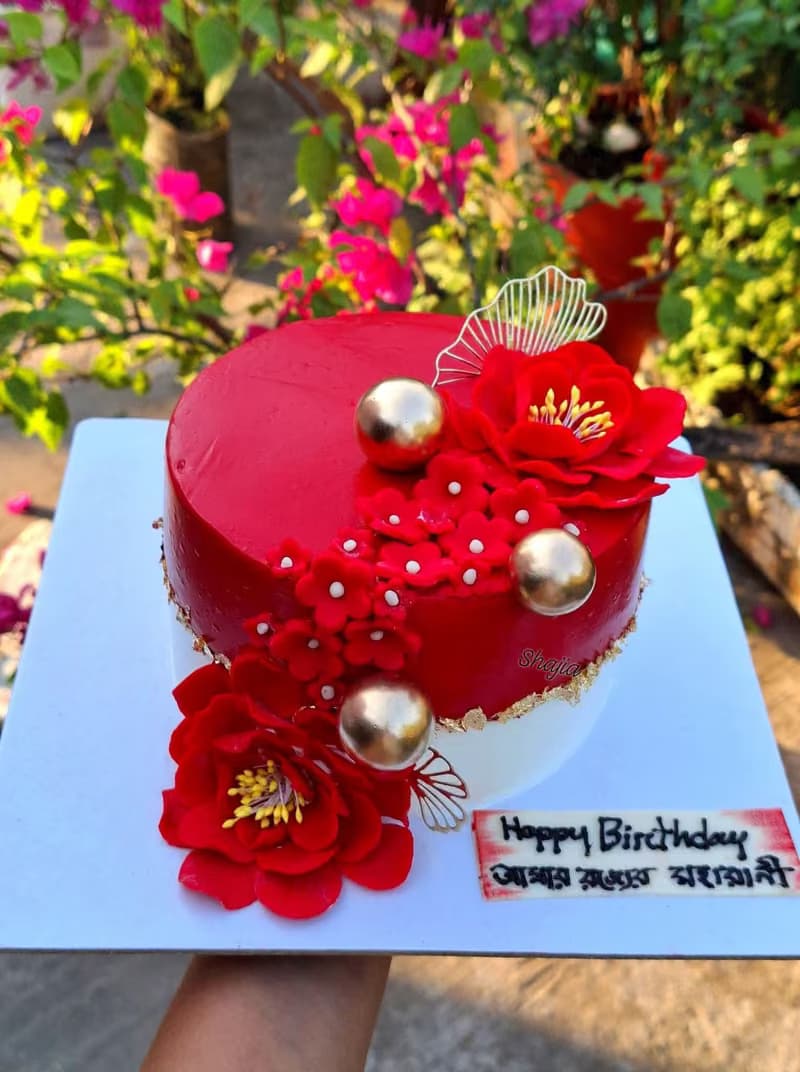 Red and gold floral birthday cake
