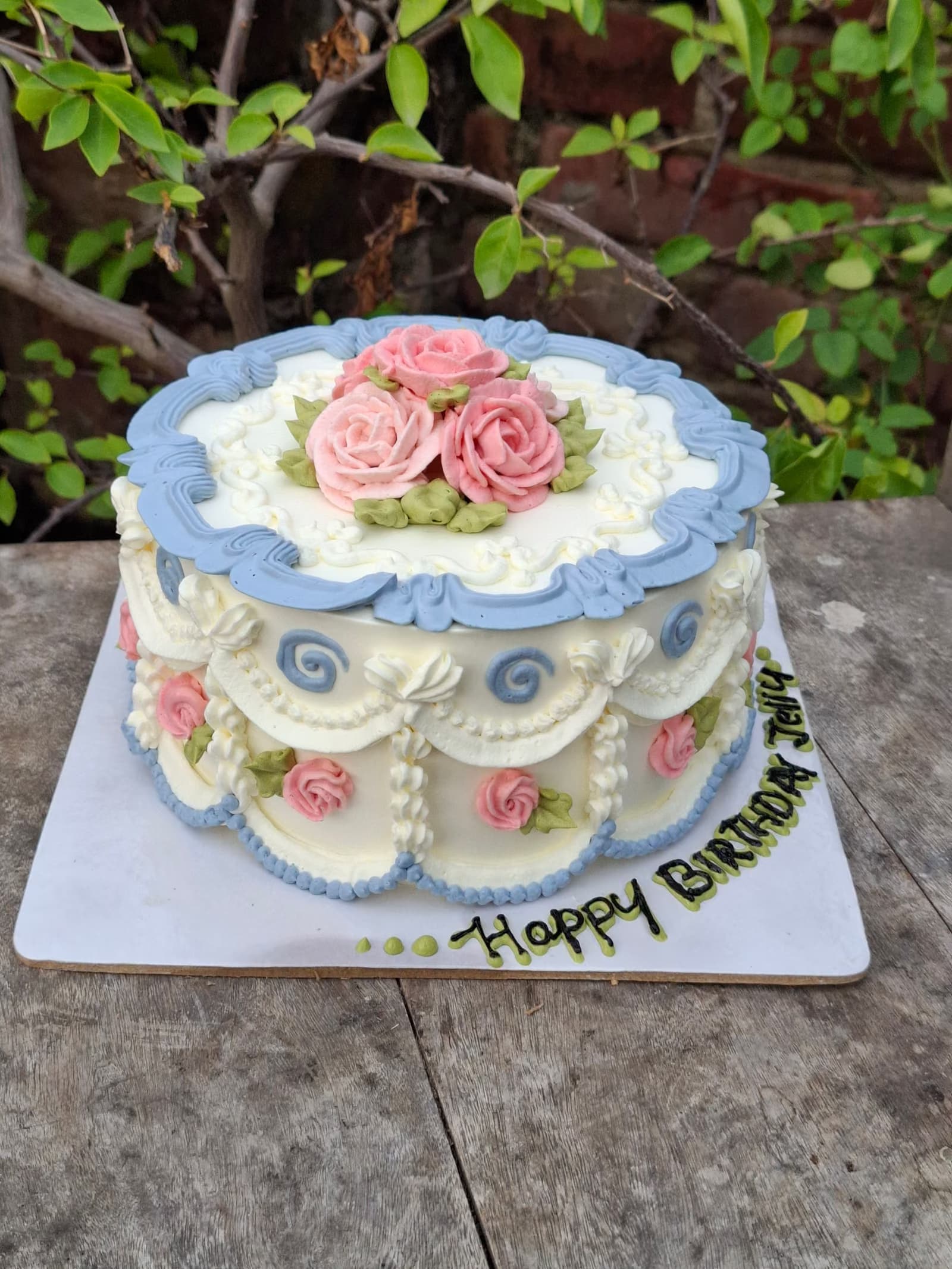 Blue ruffle cake with piped roses