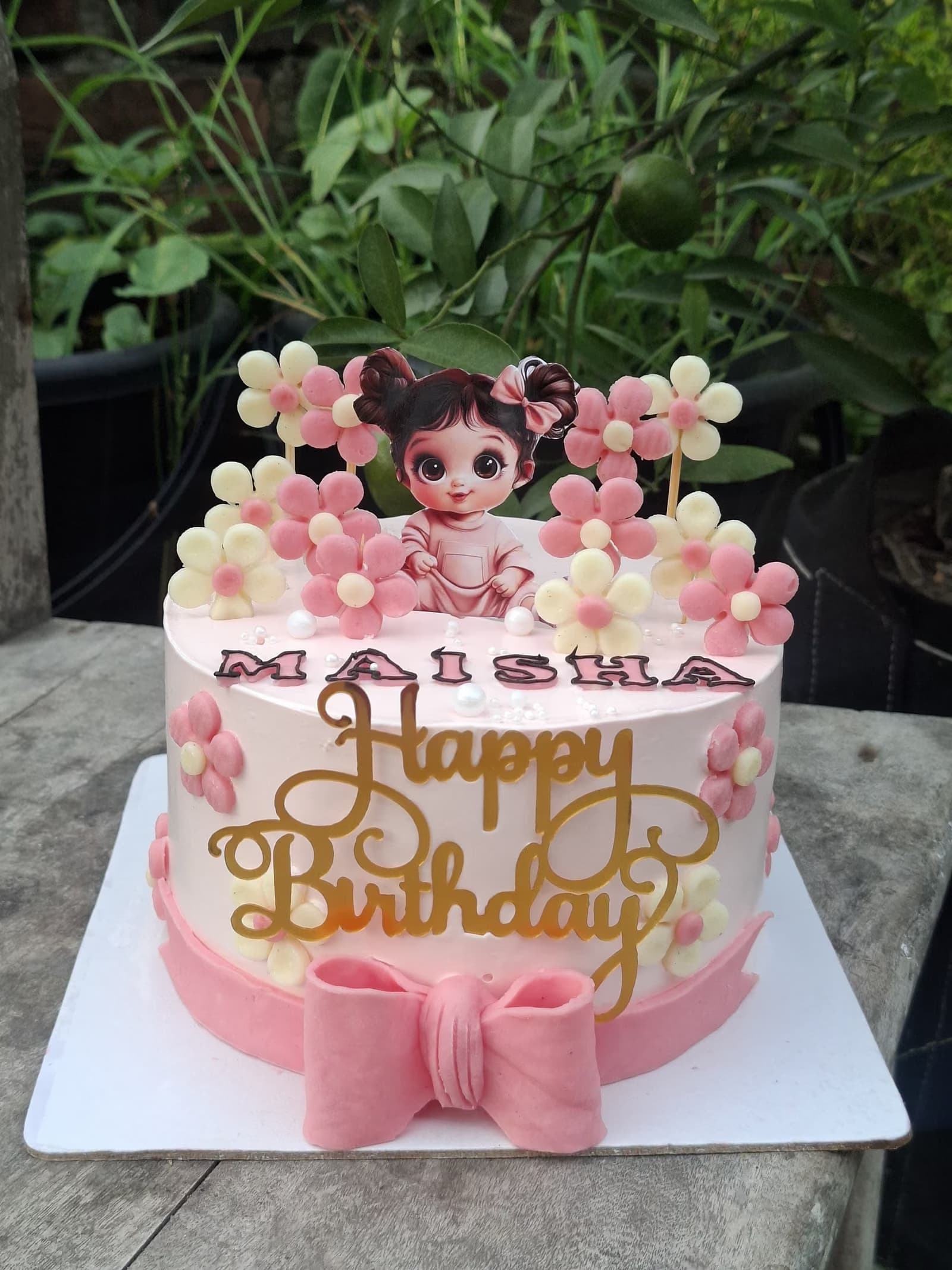 Pink doll birthday cake