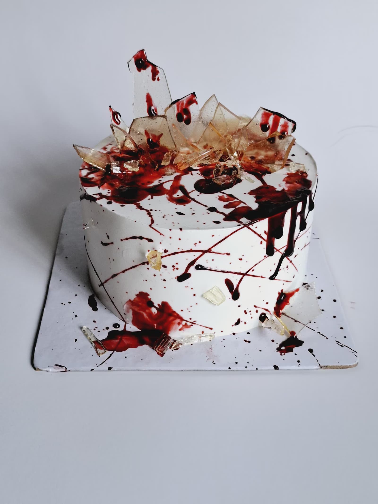 Red splatter theme cake