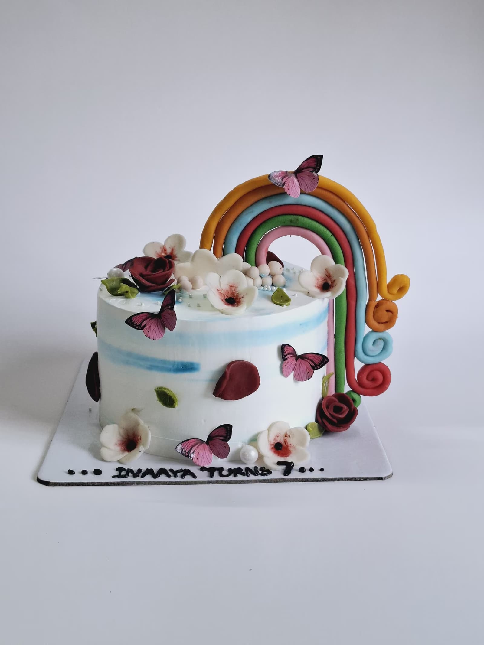 Rainbow and butterfly birthday cake